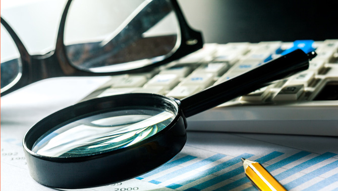 Magnifying glass and business growth graph Magnifying glass and business growth graph