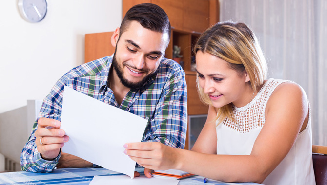 Couple filling forms for bank Couple filling forms for bank
